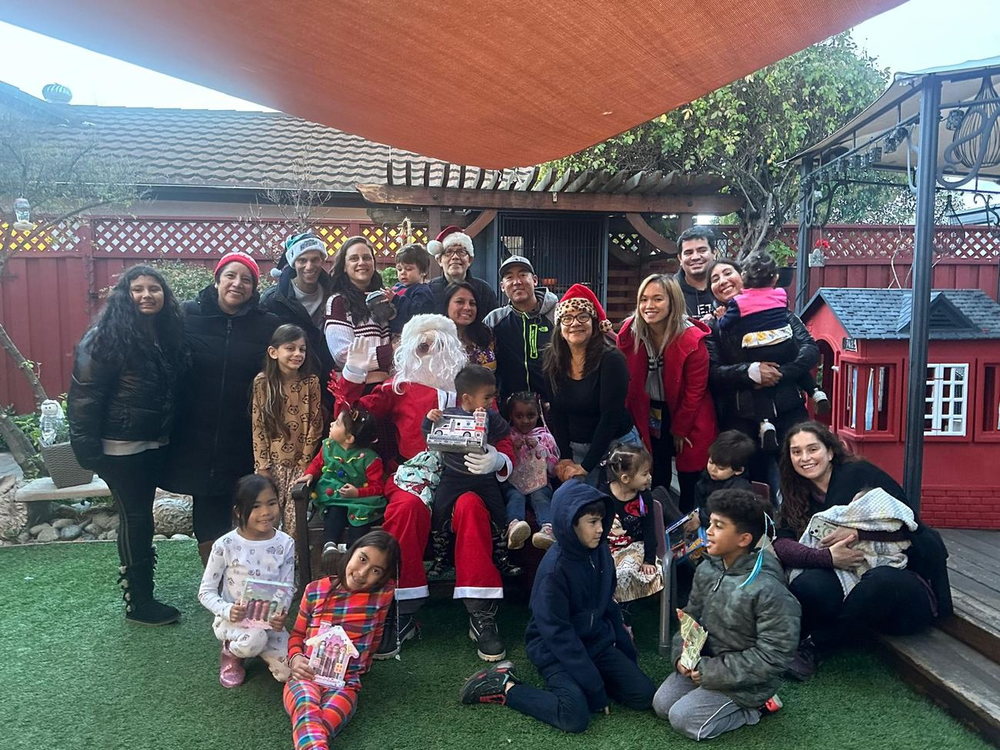 Children and families at our Christmas celebration with a special visitor